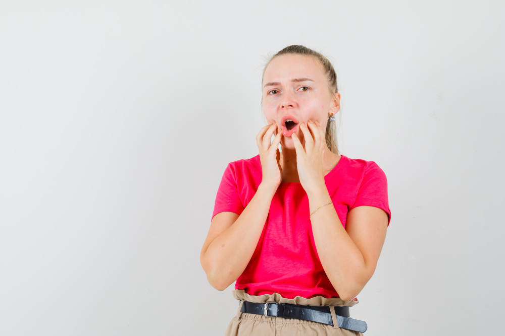 A girl with a distressed expression, showing discomfort from dry mouth