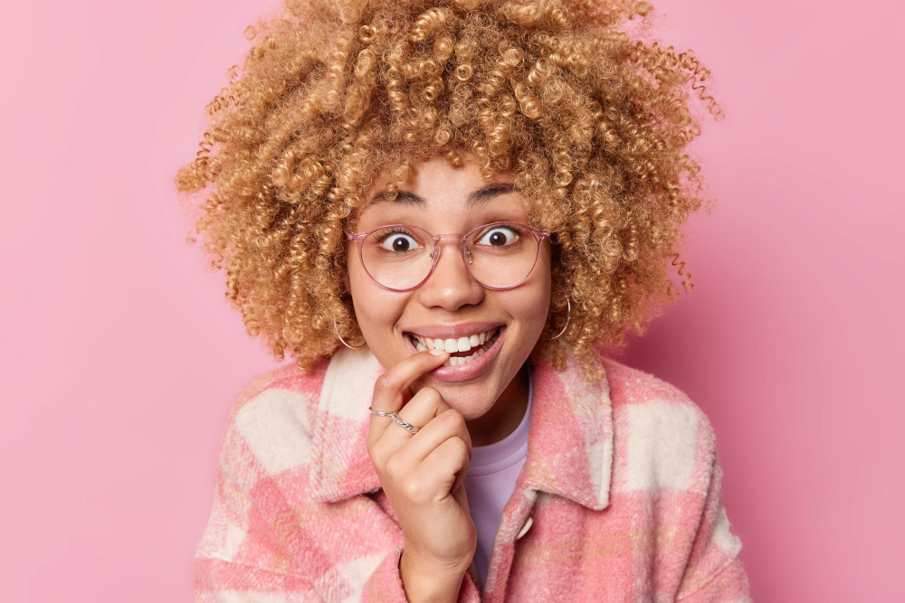 A girl with a expression, unsure about choosing between Invisalign and braces.