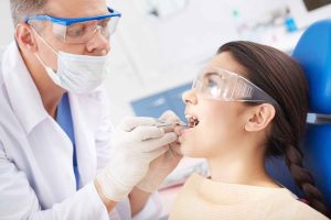 Professional dentist providing high-quality dental care to patient in a modern clinic in Oklahoma City, OK